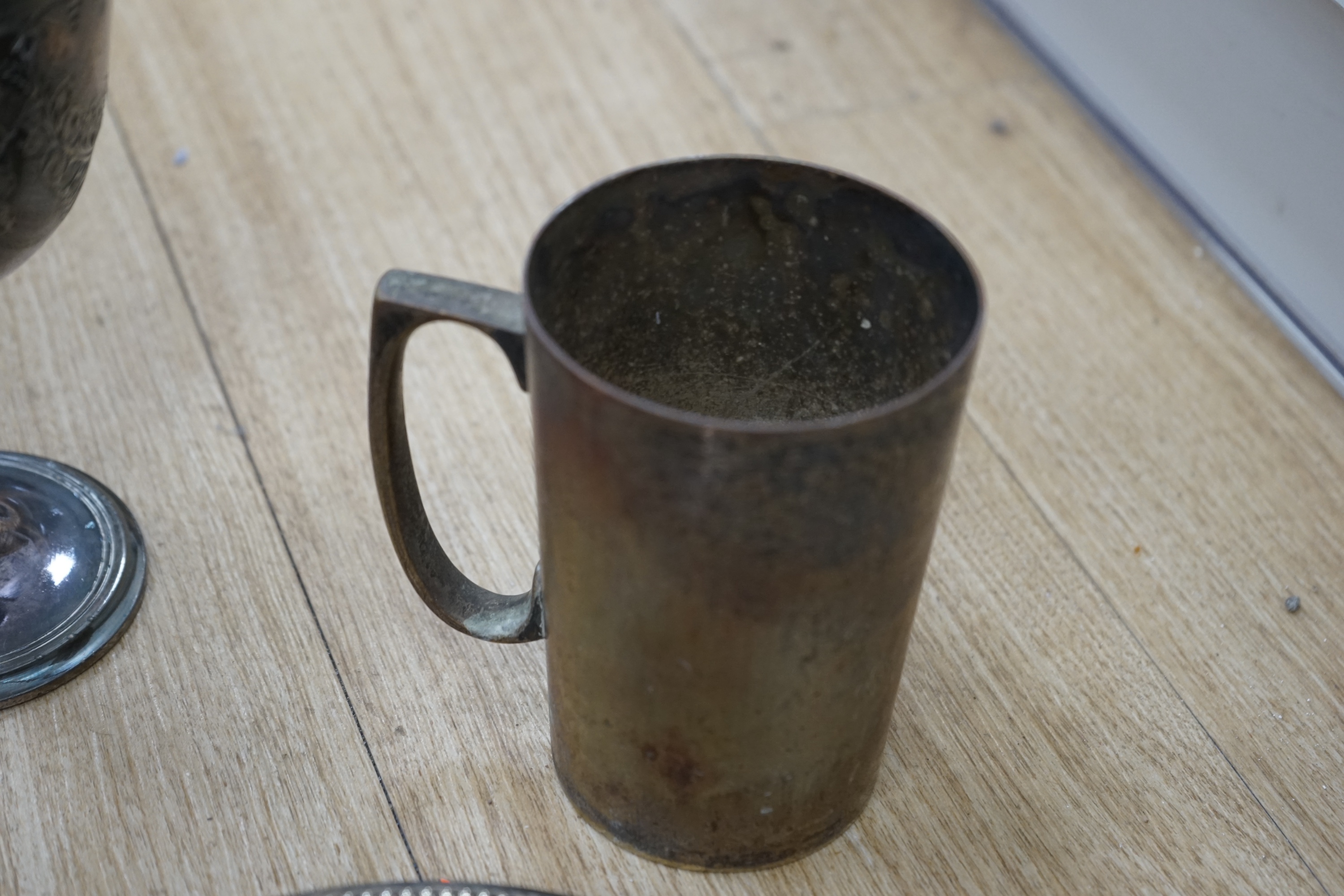 Assorted plated wares to include flatware, toast rack, biscuit barrel and goblet. Condition - fair